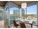 Bright dining room with a modern table set and expansive windows offering city views at 3324 Peachtree Ne Rd # 1718, Atlanta, GA 30326