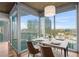 Bright dining room area with modern furnishings and expansive city views at 3324 Peachtree Ne Rd # 1718, Atlanta, GA 30326