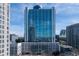 High-rise building with blue glass facade reflecting the sky and surrounding buildings at 3324 Peachtree Ne Rd # 1718, Atlanta, GA 30326