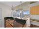 Modern kitchen with granite countertops, stainless steel appliances, and pendant lighting with city views at 3324 Peachtree Ne Rd # 1718, Atlanta, GA 30326