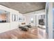 Open living area with hardwood floors, contemporary furniture, and great natural light at 3324 Peachtree Ne Rd # 1718, Atlanta, GA 30326