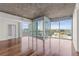 Bright and airy living room with hardwood floors, large windows, and city views at 3324 Peachtree Ne Rd # 1718, Atlanta, GA 30326