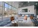 Modern lounge area with comfortable seating, fireplace, and views of the city at 3324 Peachtree Ne Rd # 1718, Atlanta, GA 30326