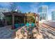 Outdoor patio with stone firepit, outdoor seating, and city views at 3324 Peachtree Ne Rd # 1718, Atlanta, GA 30326