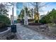 Outdoor patio featuring stonework and greenery with high rise buildings in the background at 3324 Peachtree Ne Rd # 1718, Atlanta, GA 30326