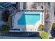 Aerial view of sparkling pool with plenty of lounge chairs and greenery at 3324 Peachtree Ne Rd # 1718, Atlanta, GA 30326