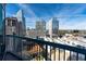 Balcony view of city skyline featuring modern architecture and a mix of residential and commercial buildings at 3324 Peachtree Ne Rd # 1718, Atlanta, GA 30326