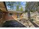 Backyard deck featuring lattice privacy fencing, brick walls, and two potted plants at , Atlanta, GA 30329