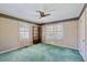 Traditional bedroom featuring a ceiling fan, two windows with shutter blinds, and an old-fashioned design at , Atlanta, GA 30329