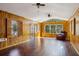 Bright living room with beautiful wood floors, wood paneled walls, and lots of natural light at , Atlanta, GA 30329