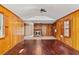 Spacious living room featuring wood paneled walls, fireplace, and dark hardwood floors at , Atlanta, GA 30329