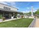 Sunny exterior of retail shops in Toco Hill with a green patch in front of Kale and Crazy at , Atlanta, GA 30329