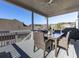 Back deck featuring an outdoor dining table and wicker chairs with views of the yard at 301 Cochin Dr, Woodstock, GA 30188