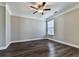 This bedroom features crown molding, ceiling fan, wood-look flooring and natural light at 301 Cochin Dr, Woodstock, GA 30188