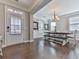 Bright dining room featuring hardwood floors, elegant lighting fixture, and a view to the entryway at 301 Cochin Dr, Woodstock, GA 30188