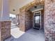 Beautiful brick archway welcomes you to this home's covered front porch at 301 Cochin Dr, Woodstock, GA 30188