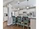 Kitchen featuring a breakfast bar with seating, stainless steel appliances, and white cabinetry at 301 Cochin Dr, Woodstock, GA 30188