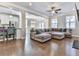 Spacious living room with hardwood floors, an open-concept design, and ample natural light at 301 Cochin Dr, Woodstock, GA 30188