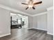 View into the main bedroom from the living room, featuring wood-look floors at 301 Cochin Dr, Woodstock, GA 30188