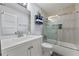 A refreshed bathroom showcases a sleek vanity, bathtub with tile surround, and modern fixtures at 3071 Balearic Se Dr, Marietta, GA 30067