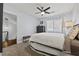 A charming bedroom with neutral colors, ceiling fan, and natural light creates a restful retreat at 3071 Balearic Se Dr, Marietta, GA 30067