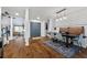 Open-concept dining area with hardwood floors and modern lighting at 3071 Balearic Se Dr, Marietta, GA 30067