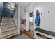 A stairway and entryway feature sleek railings and leads to a finished basement; note coatrack at 3071 Balearic Se Dr, Marietta, GA 30067