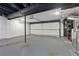 Spacious garage with epoxy flooring and ample storage, offering plenty of room for vehicles and projects at 3071 Balearic Se Dr, Marietta, GA 30067