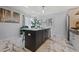 Well lit kitchen island with stainless steel dishwasher and marble floors at 3071 Balearic Se Dr, Marietta, GA 30067