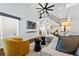 Well lit living room with view of staircase, hardwood floors, and a plush yellow chair at 3071 Balearic Se Dr, Marietta, GA 30067