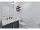 Classic powder room featuring elegant vanity, modern fixtures, and ample lighting at 3071 Balearic Se Dr, Marietta, GA 30067