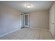 Bedroom with neutral walls and tiled flooring with an outside view from glass door at 429 Old Tennessee Ne Hwy, White, GA 30184