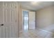 Bedroom featuring tile flooring with an en-suite entry at 429 Old Tennessee Ne Hwy, White, GA 30184