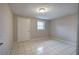 Modest bedroom features tile flooring and a single window for natural light at 429 Old Tennessee Ne Hwy, White, GA 30184