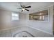 Dining area with tile floor, ceiling fan, and a pass-through to the kitchen at 429 Old Tennessee Ne Hwy, White, GA 30184