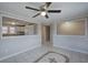 Dining area with tile floor, ceiling fan, and a pass-through to the kitchen at 429 Old Tennessee Ne Hwy, White, GA 30184