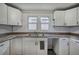 An efficient kitchen featuring white cabinets and lots of countertop space at 429 Old Tennessee Ne Hwy, White, GA 30184