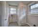 Functional laundry room with a closet and two windows at 429 Old Tennessee Ne Hwy, White, GA 30184