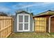 Backyard shed with new, light-colored fencing, providing space for storage and increased privacy at 429 Old Tennessee Ne Hwy, White, GA 30184