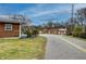 House exterior with maintained lawn and proximity to neighborhood buildings with easy street access at 429 Old Tennessee Ne Hwy, White, GA 30184