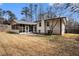 Beautiful backyard showcasing a screened porch, patio, and well-maintained lawn at 5498 Stoneybrook Se Ct, Mableton, GA 30126