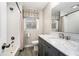 Well-lit bathroom with tiled floors, granite vanity and shower-tub combination at 5498 Stoneybrook Se Ct, Mableton, GA 30126