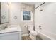 Bright bathroom featuring a subway tile shower/tub, modern vanity, and natural light from the window at 5498 Stoneybrook Se Ct, Mableton, GA 30126