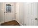 Bright foyer showcasing hardwood floors, a decorative front door, and closet space at 5498 Stoneybrook Se Ct, Mableton, GA 30126