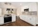 This modern kitchen has stainless steel appliances and white cabinets at 5498 Stoneybrook Se Ct, Mableton, GA 30126