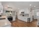 Modern kitchen features white cabinets, stainless steel appliances, and hardwood floors at 5498 Stoneybrook Se Ct, Mableton, GA 30126