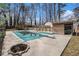 Backyard with a partially covered pool, lounge chairs and storage shed at 5498 Stoneybrook Se Ct, Mableton, GA 30126