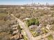 This aerial shot captures neighborhood homes, mature trees, and the Atlanta skyline at 1118 Glenwood Se Ave, Atlanta, GA 30316