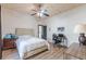 Charming bedroom featuring wood paneled walls, a ceiling fan, and wood laminate floors at 1118 Glenwood Se Ave, Atlanta, GA 30316