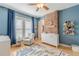 Charming Bedroom with exposed brick accent wall, modern ceiling fan, and ample natural light at 1118 Glenwood Se Ave, Atlanta, GA 30316